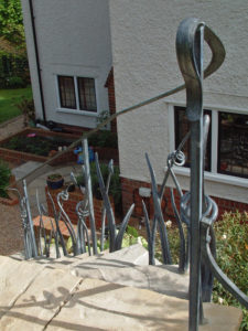 forged sculptural metalwork leaf handrail design